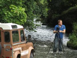 Paul photographing his Land Rover in River Dart